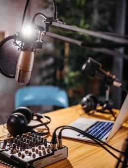 Podcast studio with microphone, sound equipment and computer