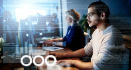 People working at computers, data from screen is visible 